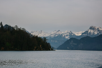 Scenic view of mountains with snowy peaks on lake lucerne.