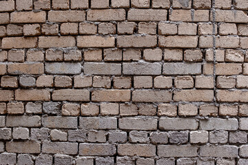 Shoddy brick work on a wall using clay bricks in Asia