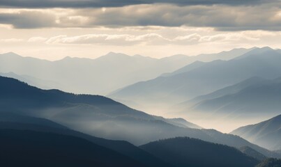 Fototapeta premium Mountain layers veiled by clouds 