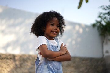 Portrait happy african american cute girl smiling face looking at camera at home, kid, child, young adorable, student, elementary school and education concept