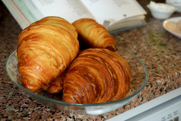 Croissant and coffee breakfast appetizers close up view