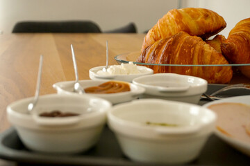 Croissant and coffee breakfast appetizers close up view