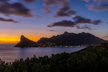 Tuinposter Hout Bay sunset over the ocean with dramatic clouds from Chapmans Peak Drive  © Nat Gold ZA
