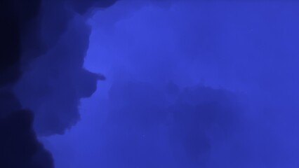 Cosmic background with a blue purple nebula and stars
