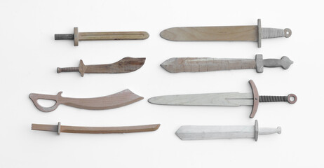 collection of wooden swords isolated on white background