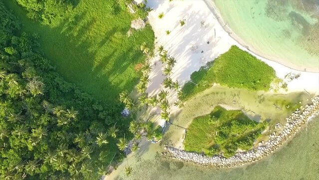 Overhead drone shot panning above beachfront of Miami Resort, a perfect getaway located in Central Greece, facing the Ionian Sea.
