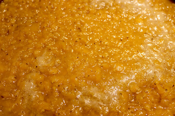 Lentil soup preparation in the kitchen close up view