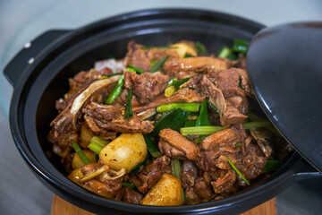A pot of delicious braised duck with water chestnuts, home cooking