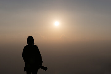 Silhouette of a Photographer at Sunrise