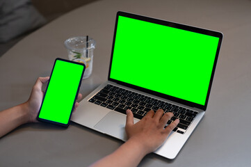 Multitasking with Green Screen Laptop and Smartphone