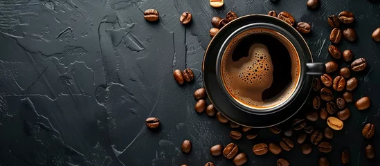 Rolgordijnen cup of black coffee surrounded by coffee beans on rustic black background  © Menganga