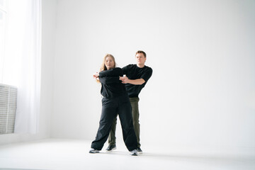 Energetic Couple Dancing Together in a Bright interior Setting - 762187353