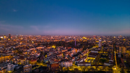 Beautiful panoramic aerial view of Milan city at sunset. Metropolis concept.