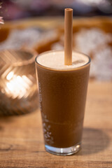 A glass of iced cappuccino.