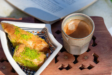Traditional arabic dessert baklava with a delicious espresso.