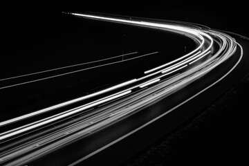 white lines of car lights on black background