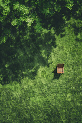 Aerial view of a chair on a green lawn