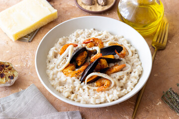 Risotto with mussels, shrimps and squid. Italian cuisine. Seafood.