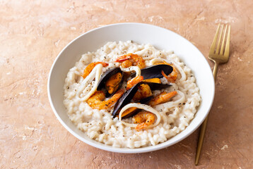 Risotto with mussels, shrimps and squid. Italian cuisine. Seafood.