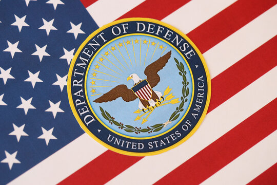 KYIV, UKRAINE - MARCH 9, 2024 US Department of Defense seal on United States of America flag close up