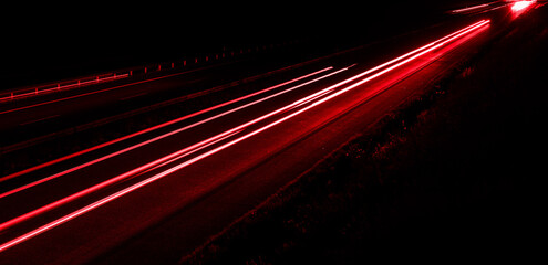 lights of cars driving at night. long exposure