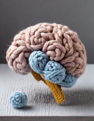 petit cerveau fabriqué en laine au crochet - obrazy, fototapety, plakaty
