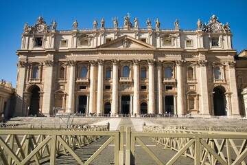 St. Peter's Basilica at daylight with bright blue sky and clouds