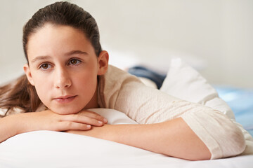 Girl, relax and thinking on bed in home, tired and peace or calm for waking up on weekend. Female...