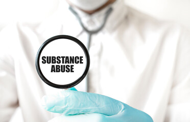 Doctor holding a stethoscope with text SUBSTANCE ABUSE, medical concept