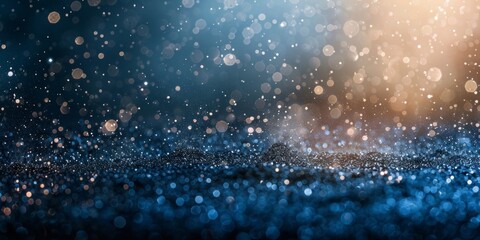 Obraz premium Glittering circles of light with a bokeh effect on a dark blue background.