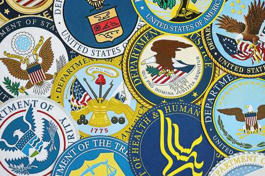 KYIV, UKRAINE - MARCH 9, 2024 Seals of United States of America Departments printed on paper close up