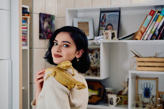 Beautiful Woman Posing with Her Two Adorable Bearded Dragon Pets