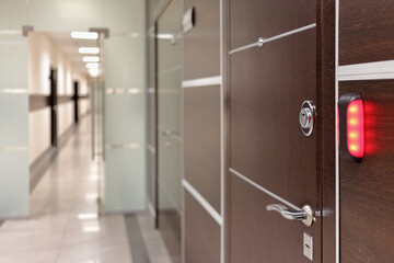 brand new interior of office with brown doors and electronic lock