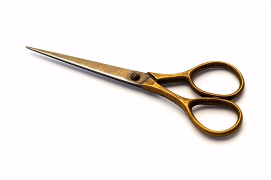 A pair of vintage, golden scissors with a sharp point, isolated on a white background.