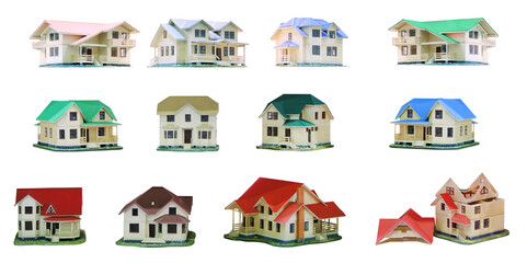 Collage of small different beautiful models of cottages stand isolated on white