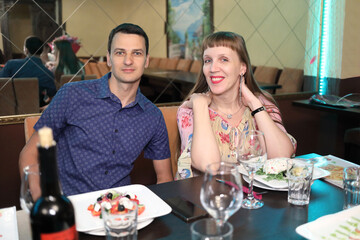 Beautiful young couple (mr) spending evening in restaurant, feast