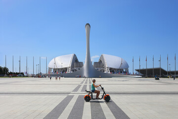 Bowl of Olympic flame Firebird and singing Fountain in Olympic park. Symbol of Olympic Games of...