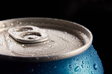 Close-up photo of aluminum closed jar of beer, coke, soda with condensation water drops against...