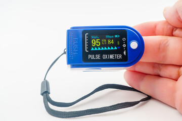 Medical pulse oximeter with an LCD. Heart and pulse rate, crucial in patient health monitoring,...