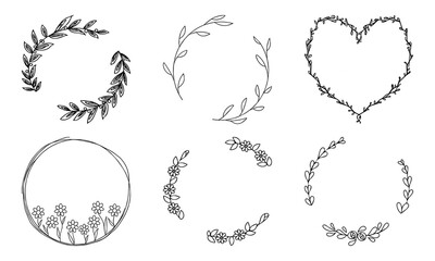 Free hand drawing set of feminine floral circular frames. Vectors of delicate looking flowers and foliage forming circle. Black and white outlines.