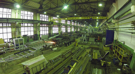Spacious factory premises with equipment and metal parts in Special Automobiles Plant , aerial view