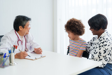 Pediatrician in white coat converses with young child and mother, expressing attentive care, bright...