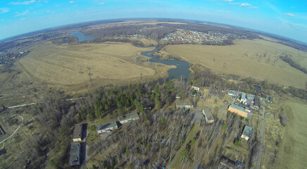 Landscape with health camp for children and field in the spring day, aerial view
