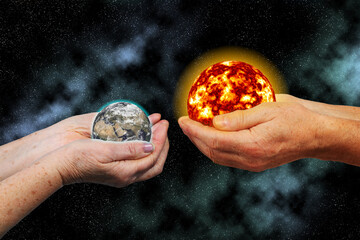 Elderly hands of man and woman holding the sun and earth against the background of space, collage. Elements of this image furnished by NASA