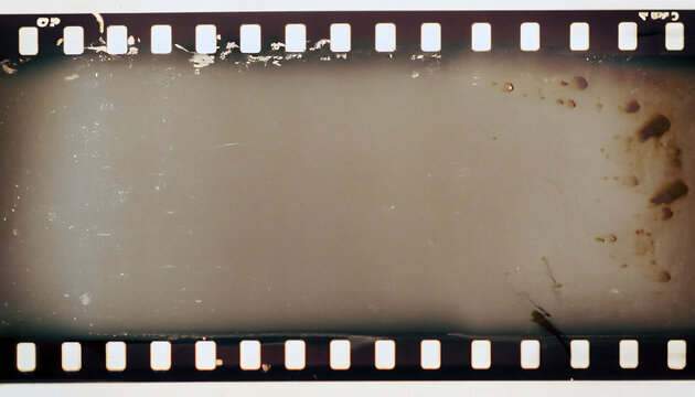 Strip of old celluloid film with dust and scratches - negative noise, copy space