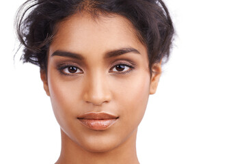 Obraz premium Beauty, makeup and portrait for Indian woman, close up and self care on white background. Confidence, hairstyle and curls for face of ethnic female model, cosmetic and salon treatment in studio