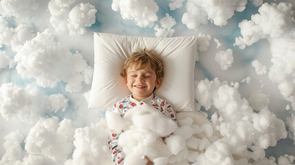 happy smiling little boy child in pajamas sleeping on white clouds in the sky, top view. healthy pleasant children's sleephappy smiling little boy child in pajamas sleeping on white clouds in the sky