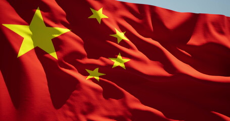 Detailed close up of the national flag of China waving in the wind on a clear day. Democracy and politics. Asian country