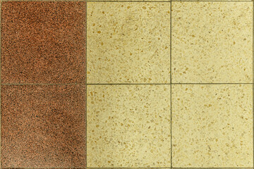abstract background of beige and brown old ceramic tiled floor close up