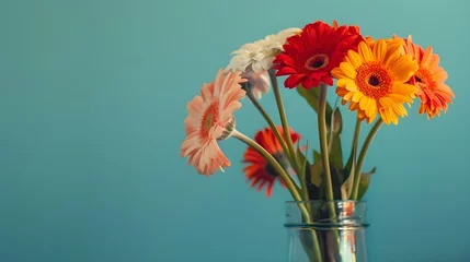Selbstklebende Fototapeten Bouquet of beautiful bright gerbera flowers in glass vase on table against color background. Space for text  © PSCL RDL